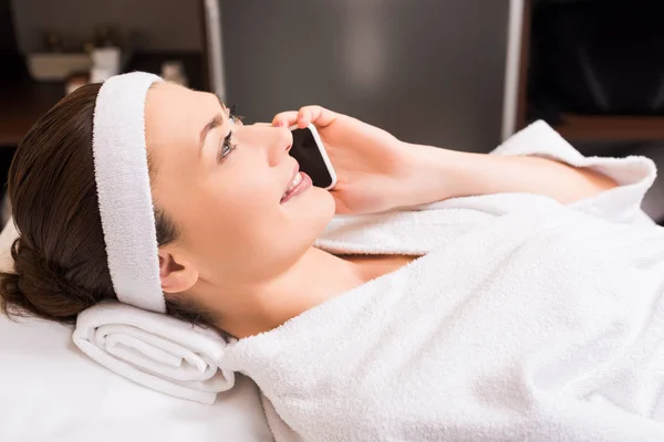 Attractive Woman Talking Smartphone Lying Beauty Salon — Stock Photo, Image