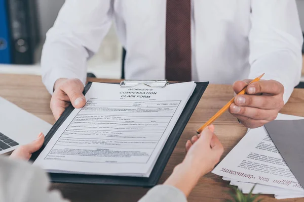 Cropped View Businessman Giving Clipboard Compensation Claim Form Pencil Woman — Stock Photo, Image