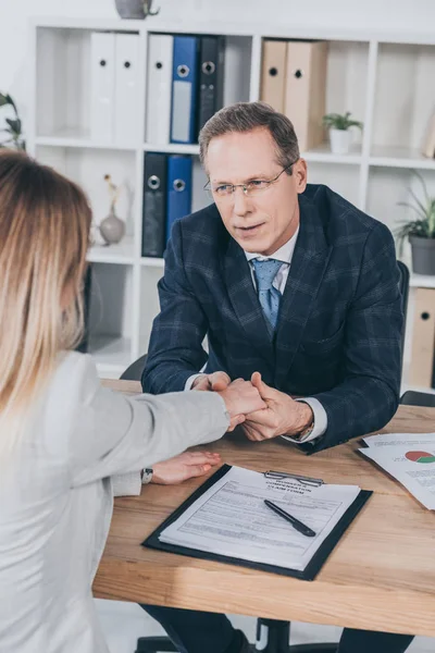 Middle Aged Businessman Holding Woman Hand Table Documents Office Compensation — Stock Photo, Image