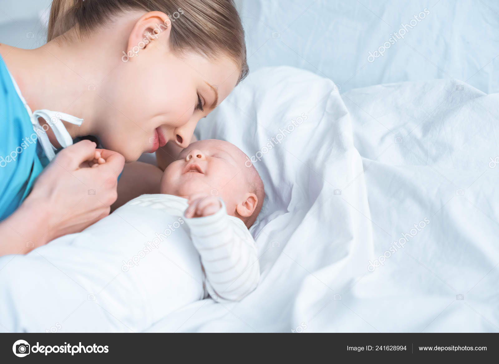 baby holding bed