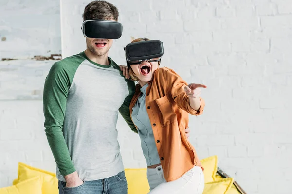 Friends Emotionally Reacting While Using Virtual Reality Headsets Home — Stock Photo, Image