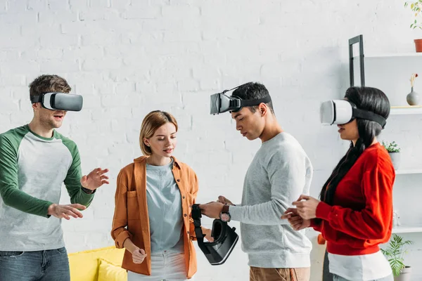 Multiethnic Friends Putting Virtual Reality Headsets — Stock Photo, Image