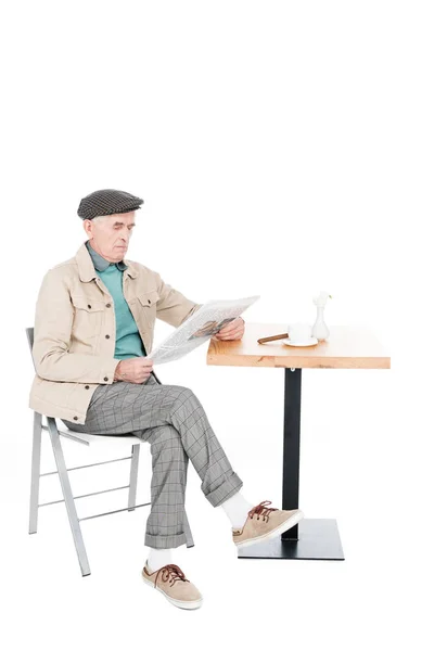 Retired Man Reading Newspaper While Sitting Chair Crossed Legs Isolated — Stock Photo, Image