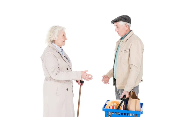 Senior Woman Looking Husband Holding Shopping Basket Isolated White — Stock Photo, Image