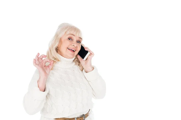 Happy Retired Woman Talking Smartphone Showing Sign Isolated White — Stock Photo, Image