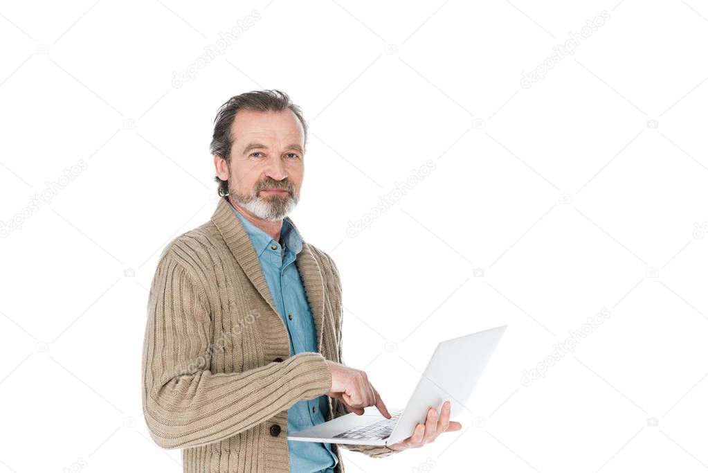 cheerful senior man holding laptop isolated on white