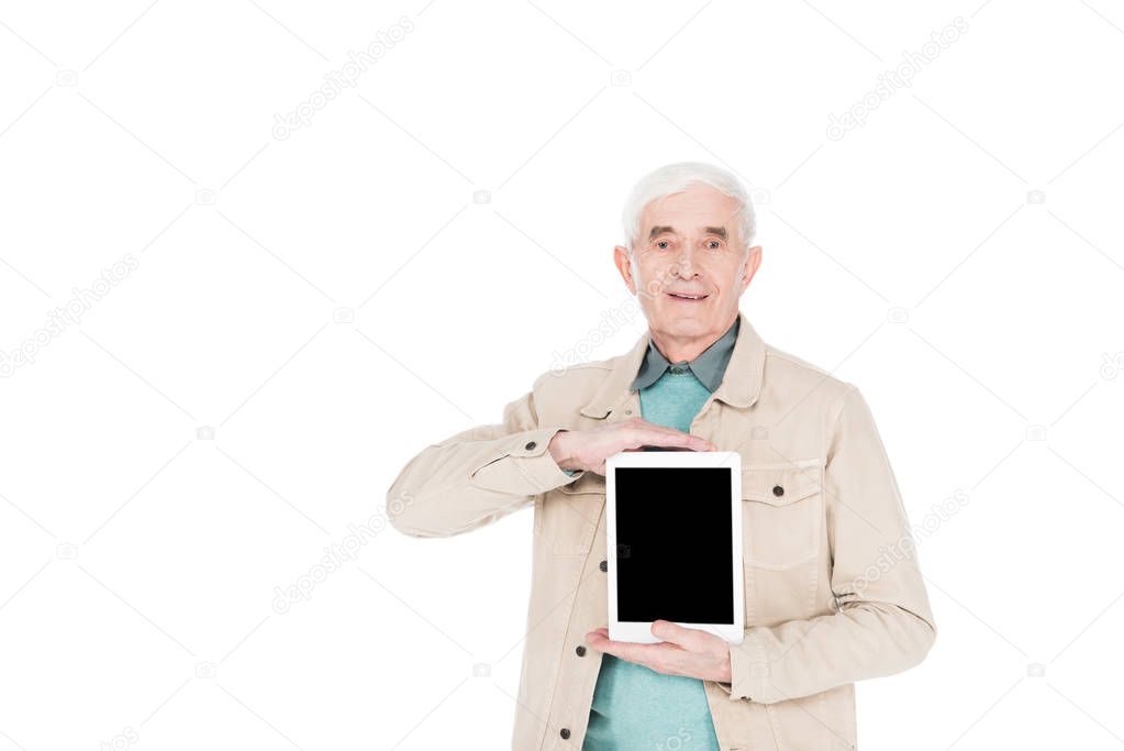cheerful retired man holding digital tablet with blank screen isolated on white