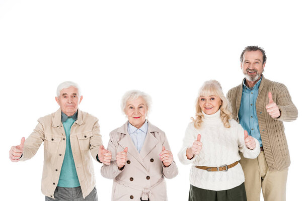 cheerful retired people showing thumbs up isolated on white