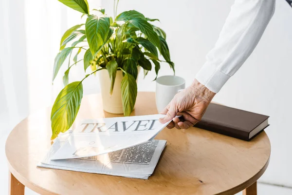 Cropped View Senior Man Taking Travel Newspaper Coffee Table — Stock Photo, Image