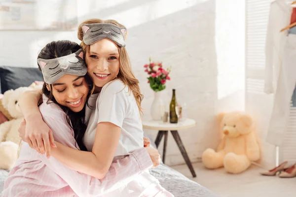 Beautiful Happy Multicultural Girls Sleeping Masks Hugging Morning Pajama Party — Stock Photo, Image