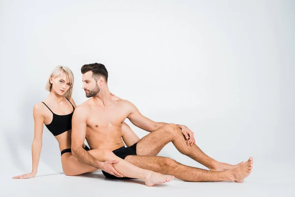 Seductive Couple Black Underwear Sitting Isolated Grey — Stock Photo, Image