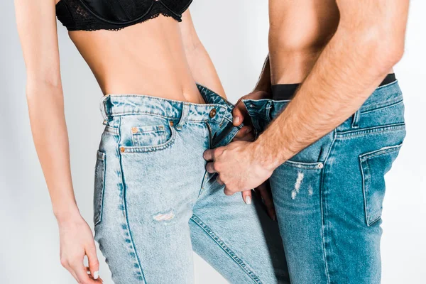 Visão Parcial Casal Sexy Decolando Jeans Isolado Cinza — Fotografia de Stock