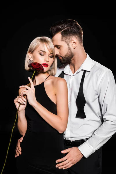 Handsome Boyfriend Embracing Sensual Girlfriend Red Rose Isolated Black — Stock Photo, Image