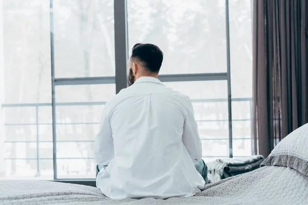 Back View Brunette Man White Shirt Sitting Bed — Stock Photo, Image