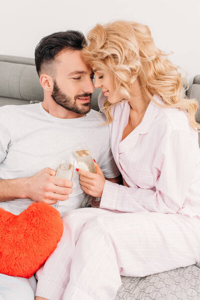 Blissful couple drinking champagne in valentine's day
