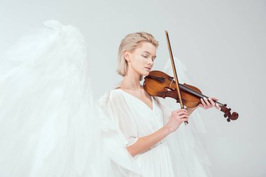 beautiful woman in angel costume with wings playing violin isolated on white clipart