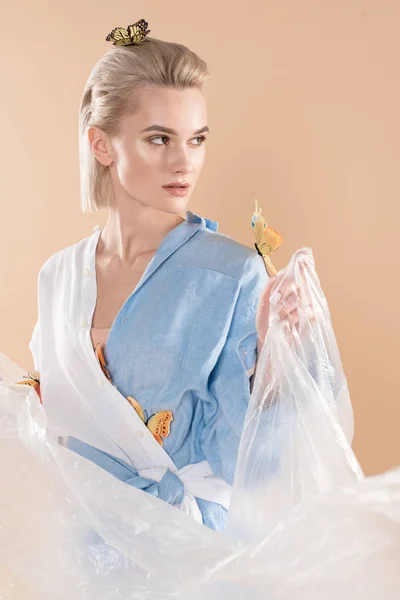 Attractive Girl Holding Polyethylene While Standing Butterflies Eco Clothing Isolated — Stock Photo, Image