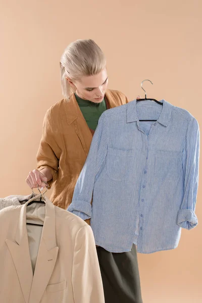 Young Woman Looking Eco Clothing Hanger Isolated Beige Environmental Saving — Stock Photo, Image