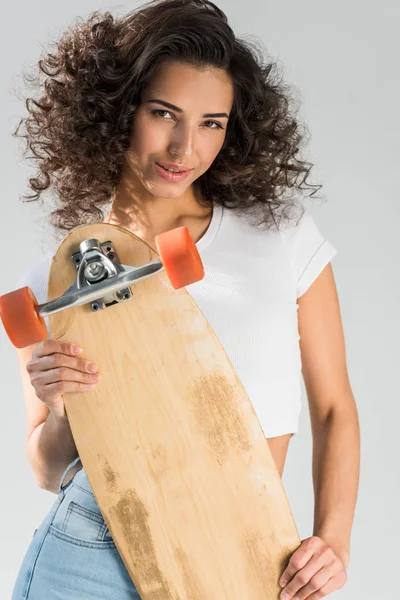 Attractive Curly Girl Holding Wooden Longboard Grey Background — Stock Photo, Image