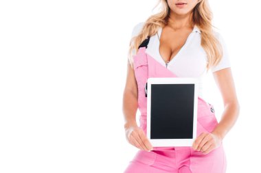 cropped view of handy woman in pink uniform holding digital tablet with blank screen isolated on white clipart