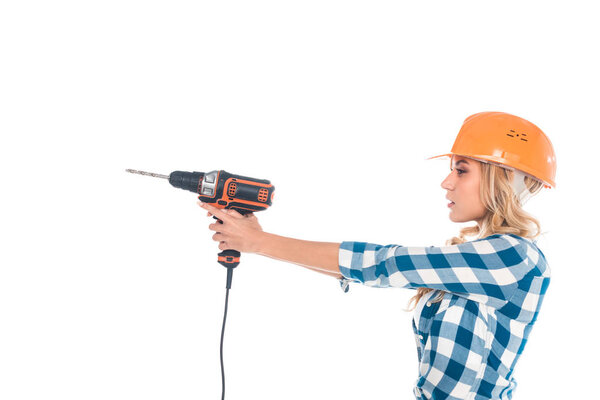 blonde handy woman in blue shirt and orange hardhat holding screwdriver isolated on white