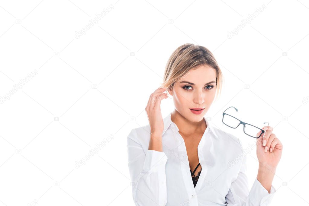 teacher in blous with open neckline taking off glasses isolated on white