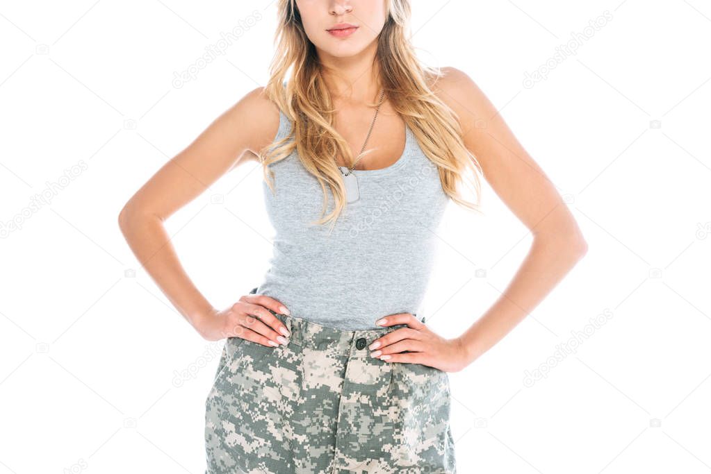 cropped view of militarywoman in grey t-shirt and camouflage pants isolated on white