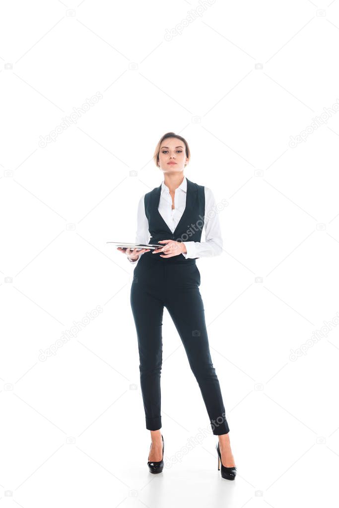 waitress in black uniform standing and holding tray on white background