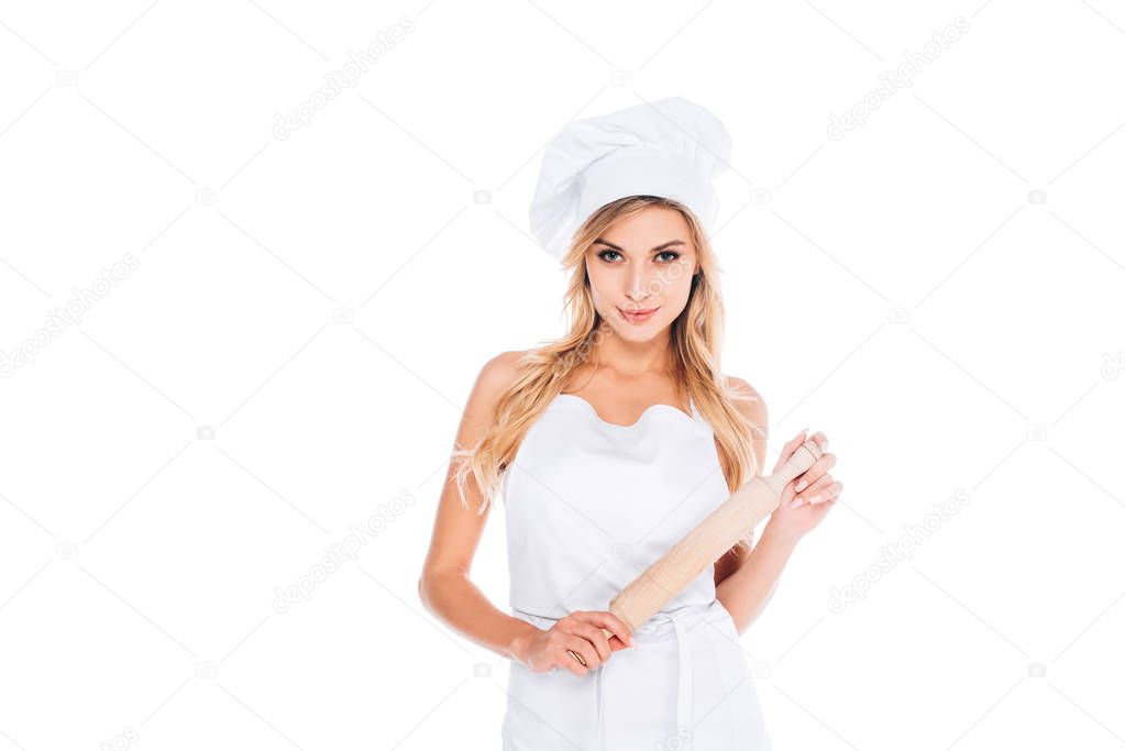 attractive cook woman in uniform holding rolling pin isolated on white