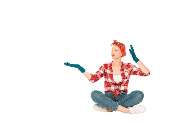 floating girl in jeans and plaid shirt looking away isolated on white