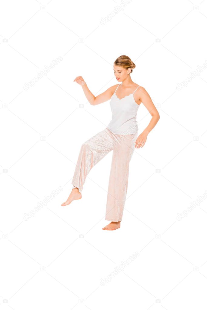 girl in pyjamas levitating in air isolated on white with copy space