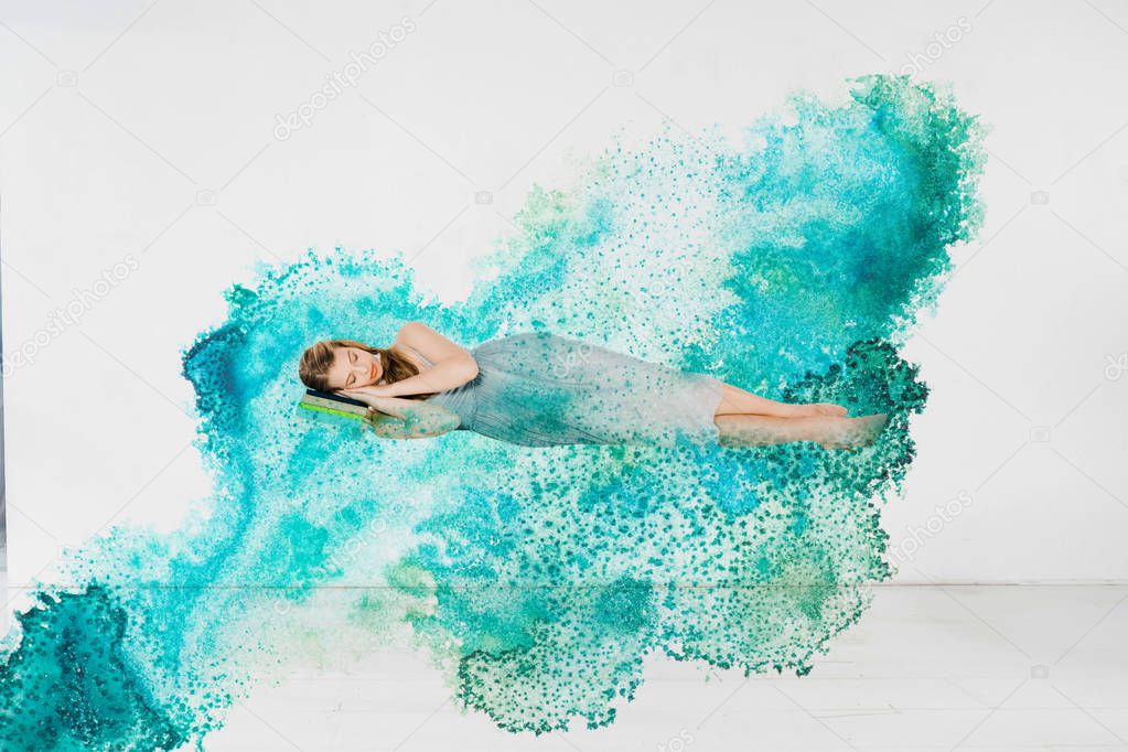  girl in blue dress sleeping on book in turquoise splash illustarion