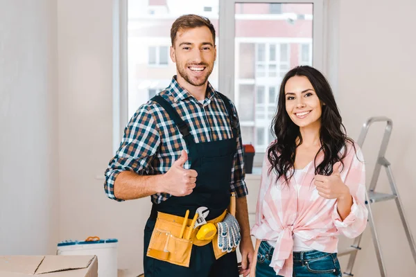 Attractive Woman Handsome Handyman Showing Thumbs — Stock Photo, Image