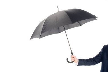 cropped view of businessman holding black umbrella isolated on white clipart