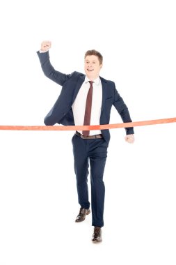 successful young businessman running to red finishing line isolated on white clipart