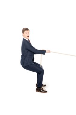 young shocked businessman pulling rope isolated on white clipart