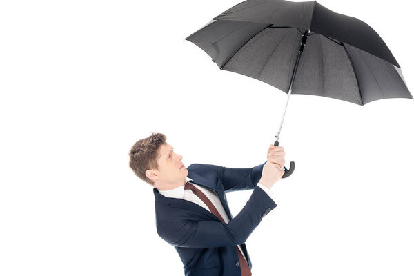 stylish young businessman holding umbrella isolated on white