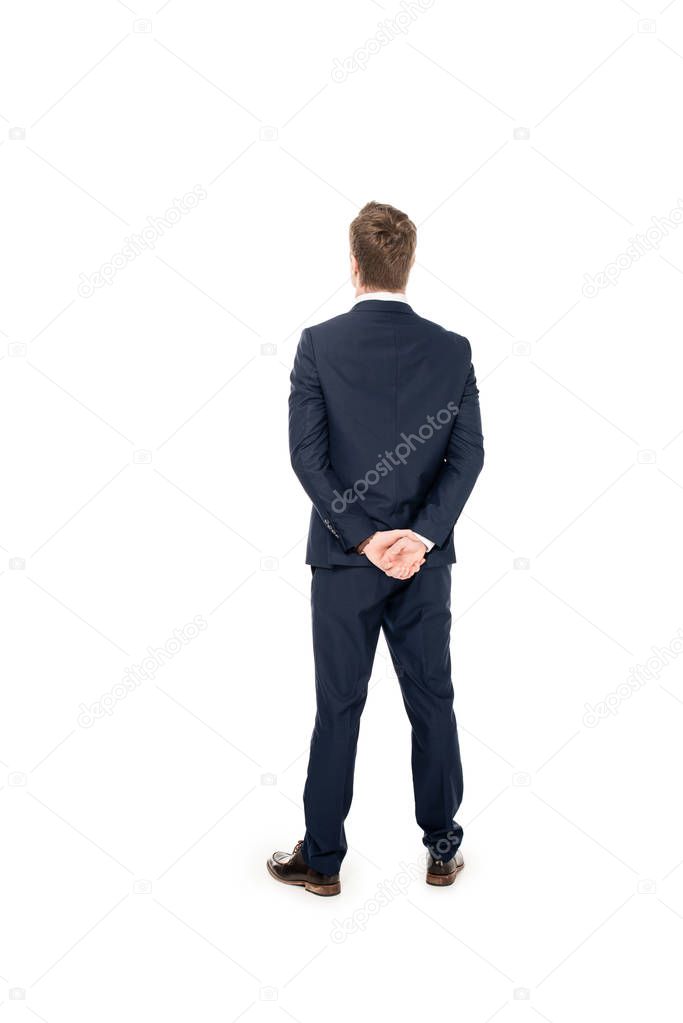 rear view of young businessman standing suit isolated on white