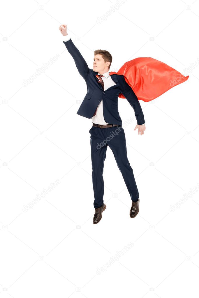 super businessman flying in suit and red cloak isolated on white