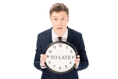 shocked businessman holding clock with 