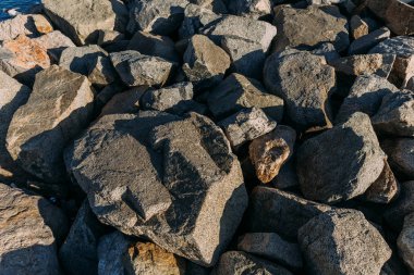 natural granite stones lighted with sun, barcelona, spain clipart