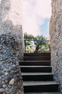 staircase with multicolored stone walls, barcelona, spain clipart