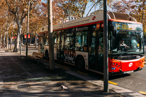BARCELONA, SPAIN - DECEMBER 28, 2018: bus moving on city road on sunny day