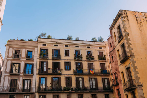 multicolored houses with fenced balconies, barcelona, spain