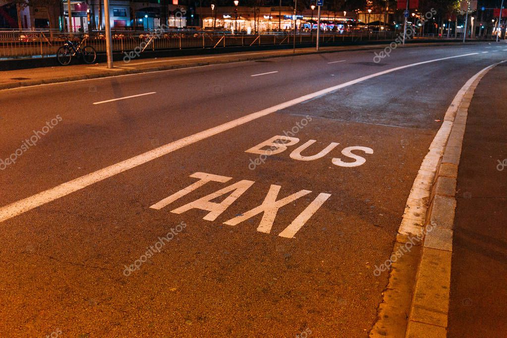 Asphalt roadway with white markings, 