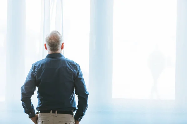 Back View Man Standing Window Home — Stock Photo, Image