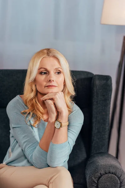 Dreamy Blonde Woman Thinking While Sitting Armchair Home — Stock Photo, Image