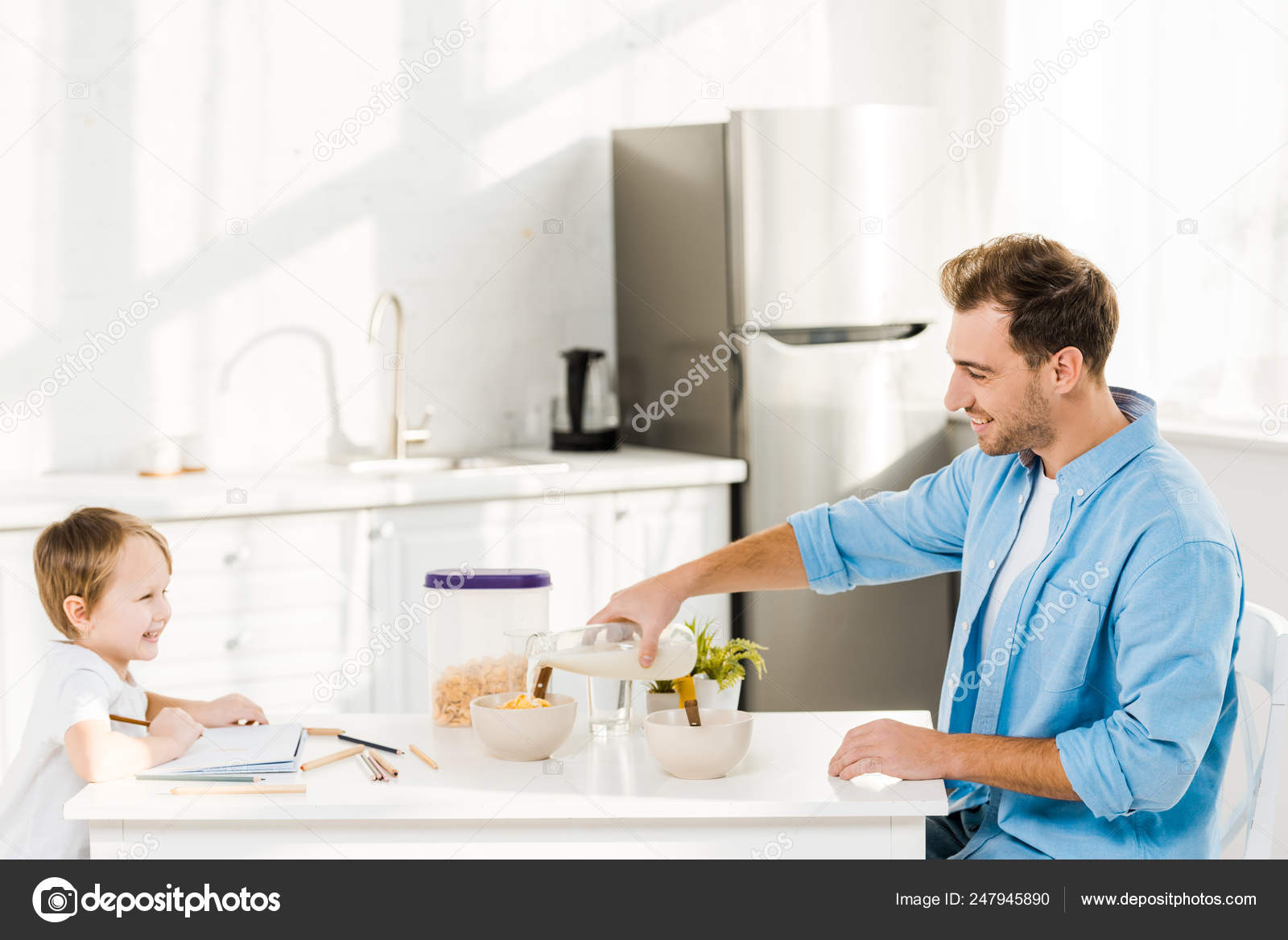 Father Pouring Milk Bowl While Preschooler Drawing Breakfast Kitchen