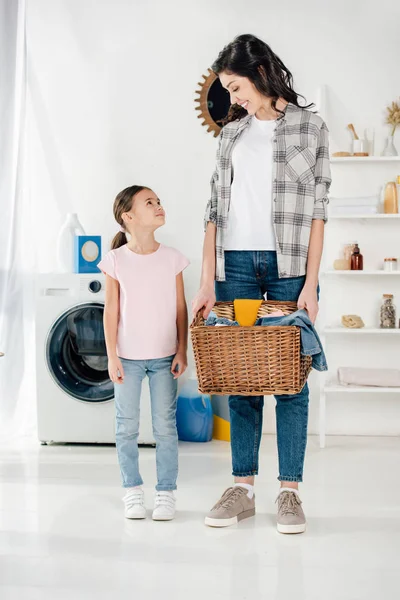 Daughter Pink Shirt Standing Mother Grey Shirt Basket Laundry Room — Stock Photo, Image