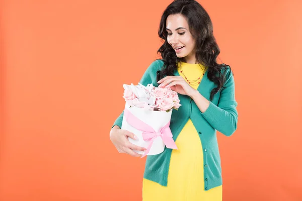 Excited Brunette Pregnant Woman Touching Flowers Isolated Orange — Stock Photo, Image